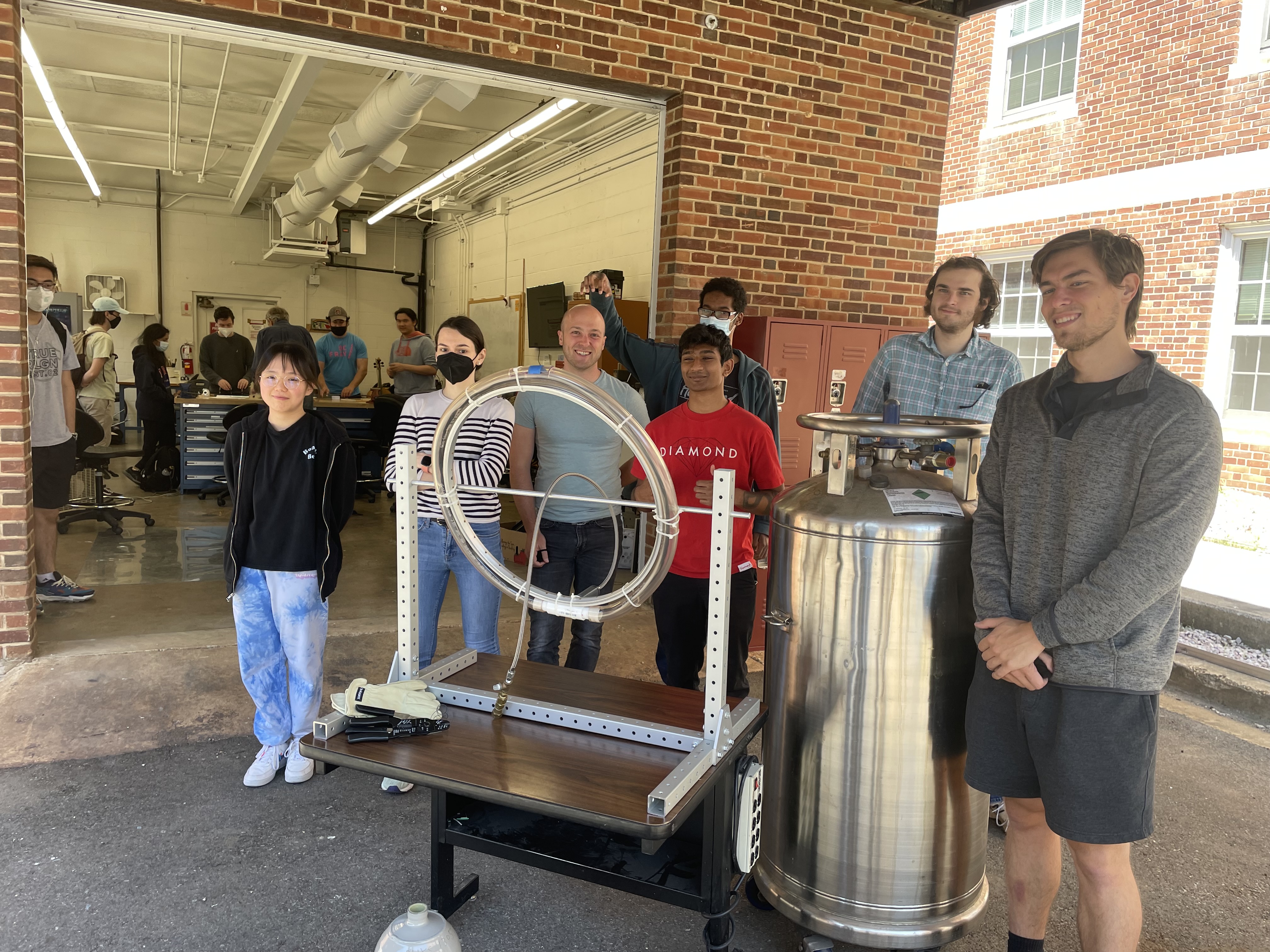PHYS 499X students demonstrate their Spring 2022 semester project, a liquid nitrogen-cooled superconducting loop. From left to right: Peiyu Qin, Alexandra Pick-Aluas, Meyer Taffel, Noah Doney, Ankith Rajashekar, Brian Robbins, and Dylan Christopherson. Image courtesy of Daniel Lathrop.