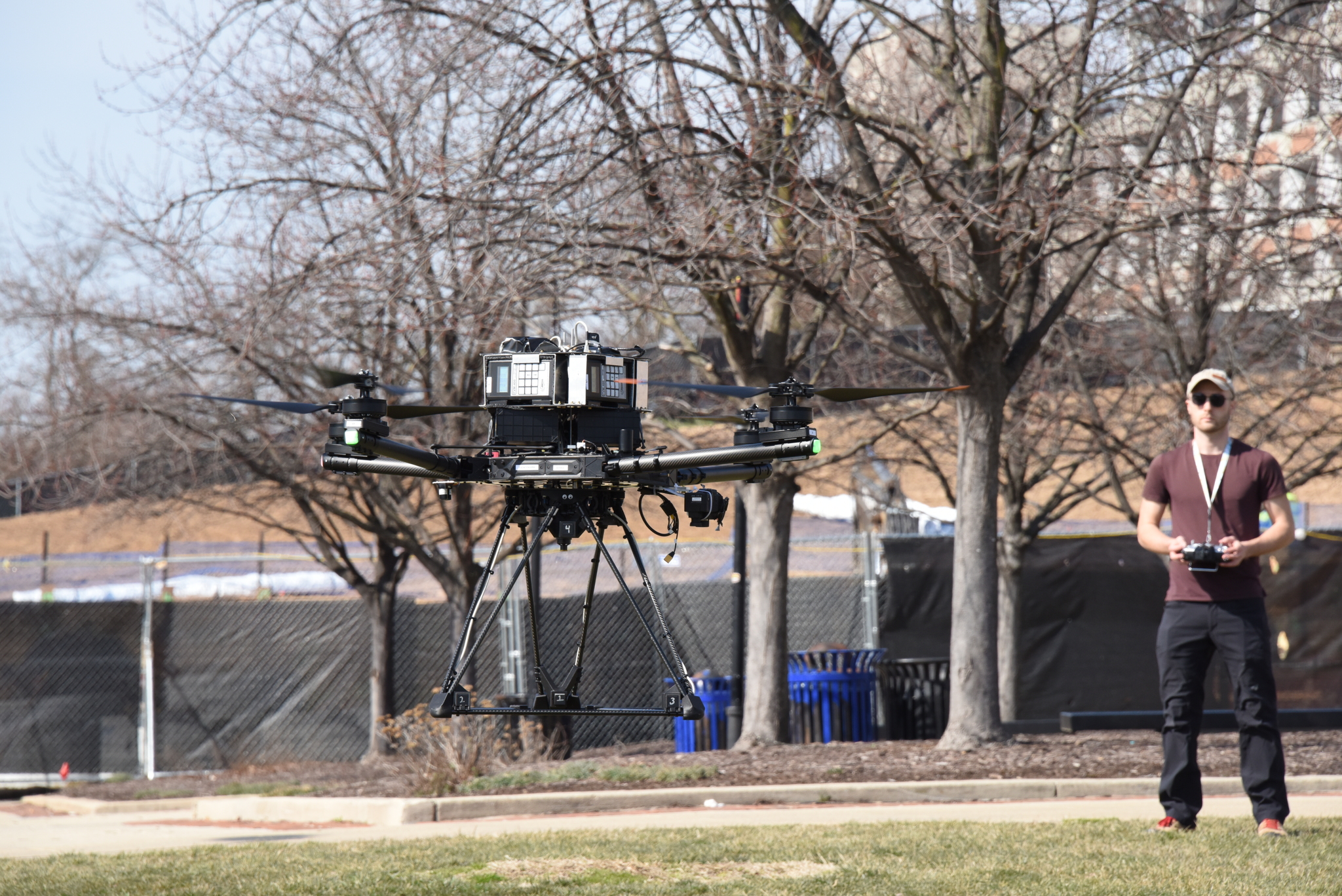Licensed drone pilot and physics senior Meyer Taffel is test-flying a drone over campus to magnetically map UMD's underground utilities. Credit: Dan Lathrop