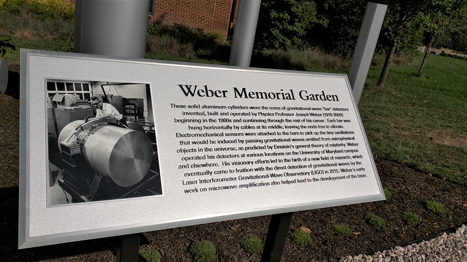 The plaque on display at the Weber Memorial outside of the Physical Sciences Complex
