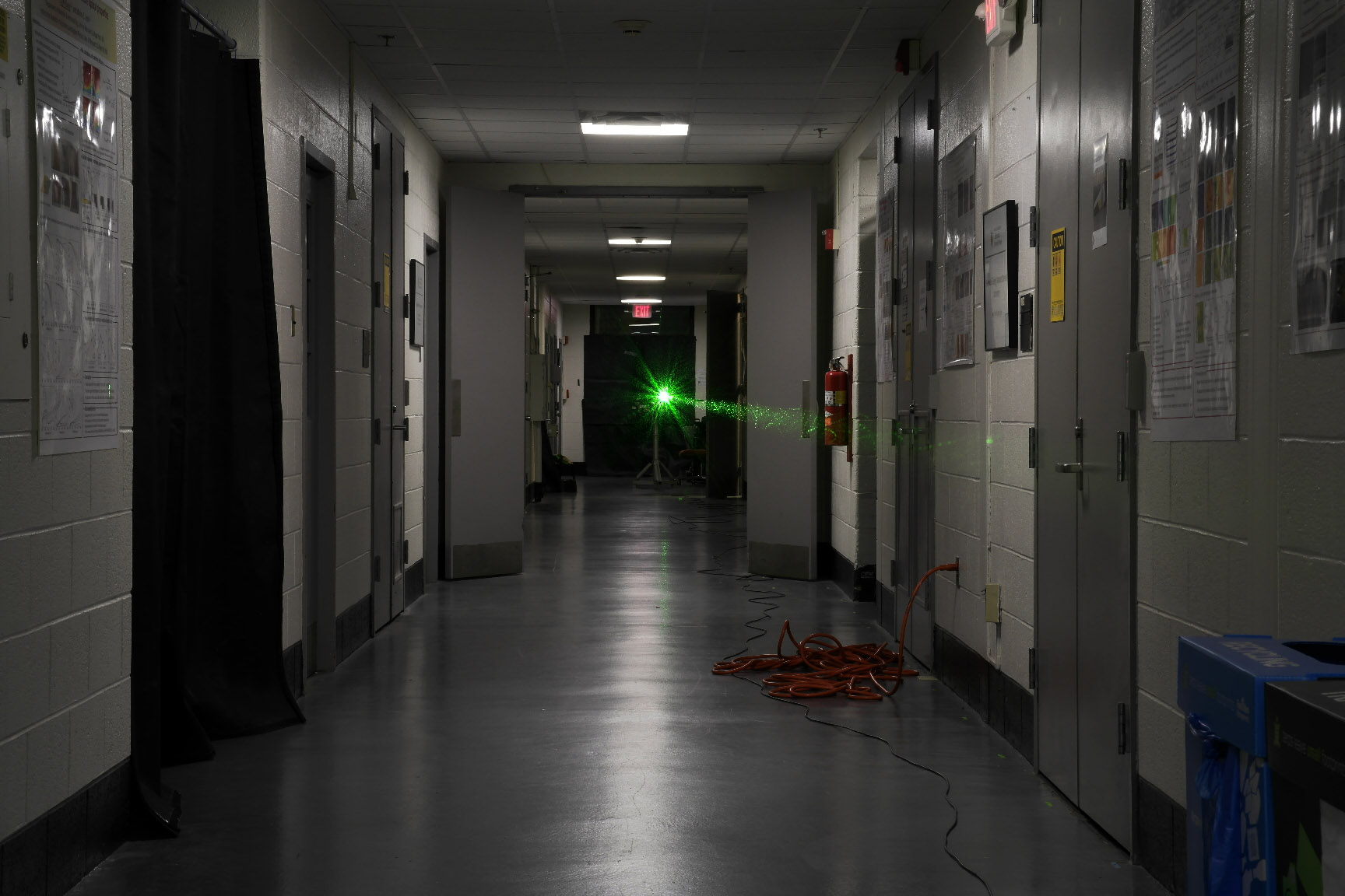 A laser is sent down a UMD hallway in an experiment to corral light as it makes a 45-meters-long journey.