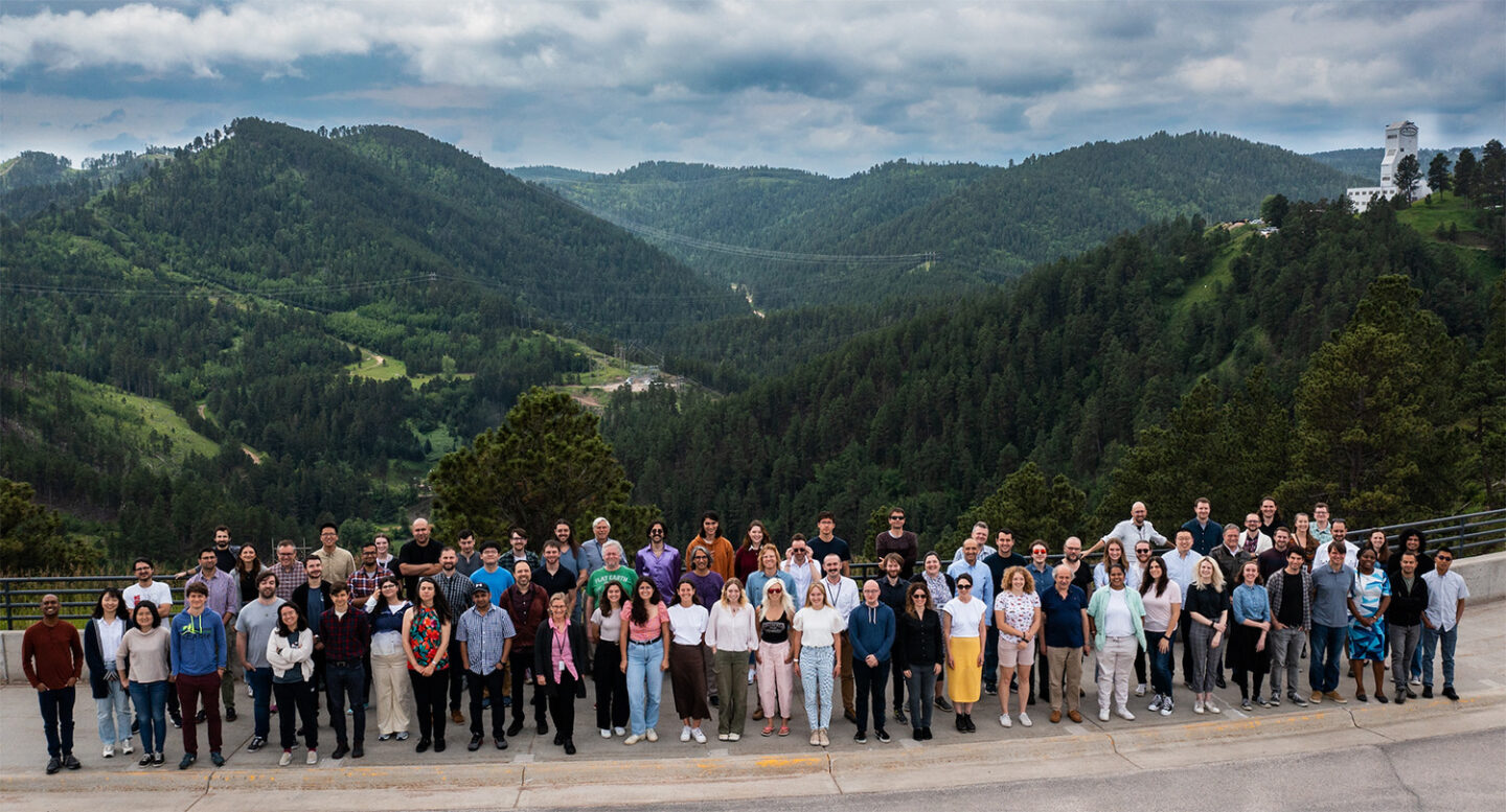  Members of the LZ collaboration gather at the Sanford Underground Research Facility in June 2023, shortly after the experiment began the recent science run. (Credit: Stephen Kenny/Sanford Underground Research Facility)