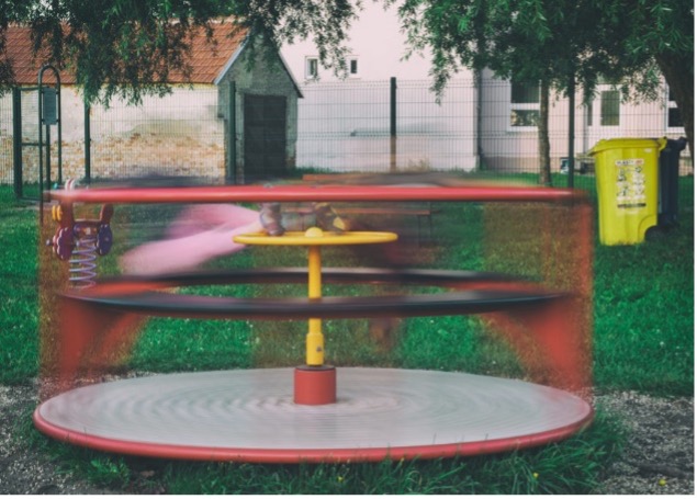 Similarities exist between spinning everyday items, like a playground merry-go-round, and spinning vortices of light. Image credit: Martin Vorel